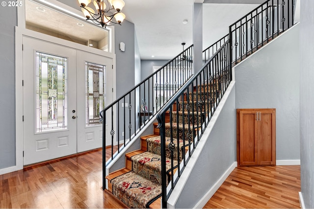 1155 Holly Ave, Cottage Grove, OR 97424 - foyer entrance featuring light wood-type flooring, a chandelier, stairway, and a high ceiling
