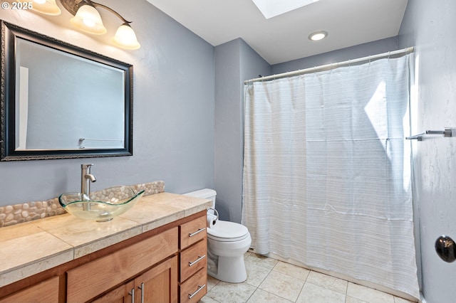 1155 Holly Ave, Cottage Grove, OR 97424 - full bath featuring vanity, a skylight, tile patterned floors, and a shower with shower curtain