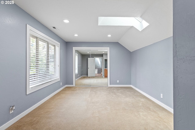 1155 Holly Ave, Cottage Grove, OR 97424 - empty room featuring a skylight, carpet, recessed lighting, and lofted ceiling