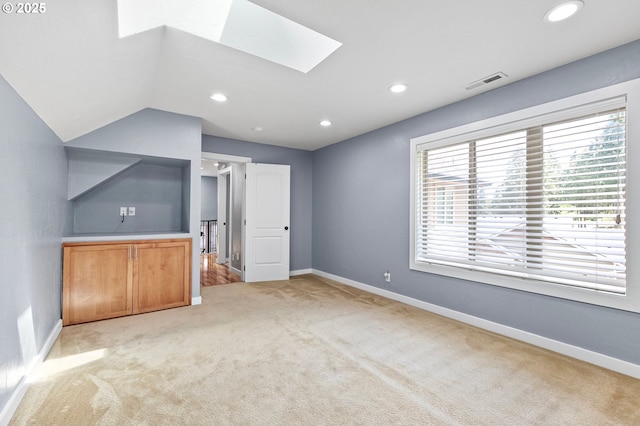 1155 Holly Ave, Cottage Grove, OR 97424 - unfurnished living room featuring a skylight, light colored carpet, and recessed lighting