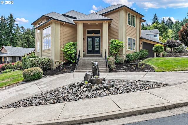 1155 Holly Ave, Cottage Grove, OR 97424 - view of front of home with french doors, a front yard, an attached garage, and roof with shingles