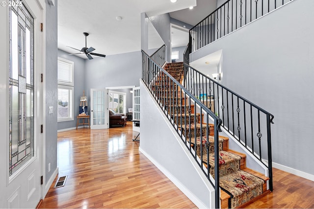1155 Holly Ave, Cottage Grove, OR 97424 - stairway featuring a high ceiling, a ceiling fan, wood finished floors, and french doors