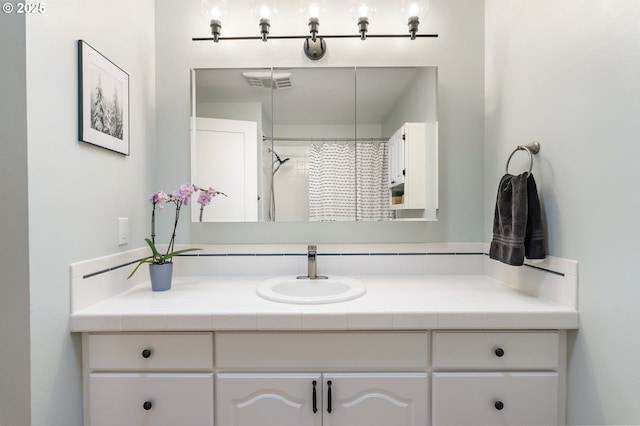 full bath with vanity and a shower with curtain