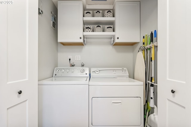 laundry area featuring cabinet space and washer and dryer