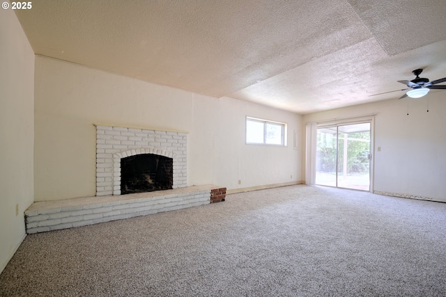 1742 Escalante St, Eugene, OR 97404 - unfurnished living room with a textured ceiling, a fireplace, a ceiling fan, and carpet floors