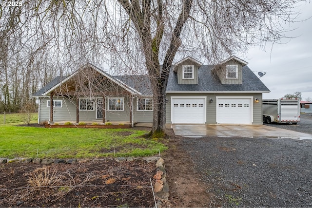 cape cod-style house with driveway, a shingled roof, and a front lawn