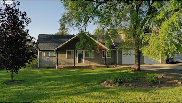 34949 Bond Rd, Lebanon, OR 97355 - view of front of home with gravel driveway, a garage, roof with shingles, and a front lawn