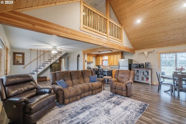 34949 Bond Rd, Lebanon, OR 97355 - living area with high vaulted ceiling, wooden ceiling, stairs, dark wood-style flooring, and baseboards
