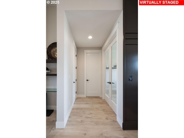 corridor with baseboards, recessed lighting, and light wood-style floors