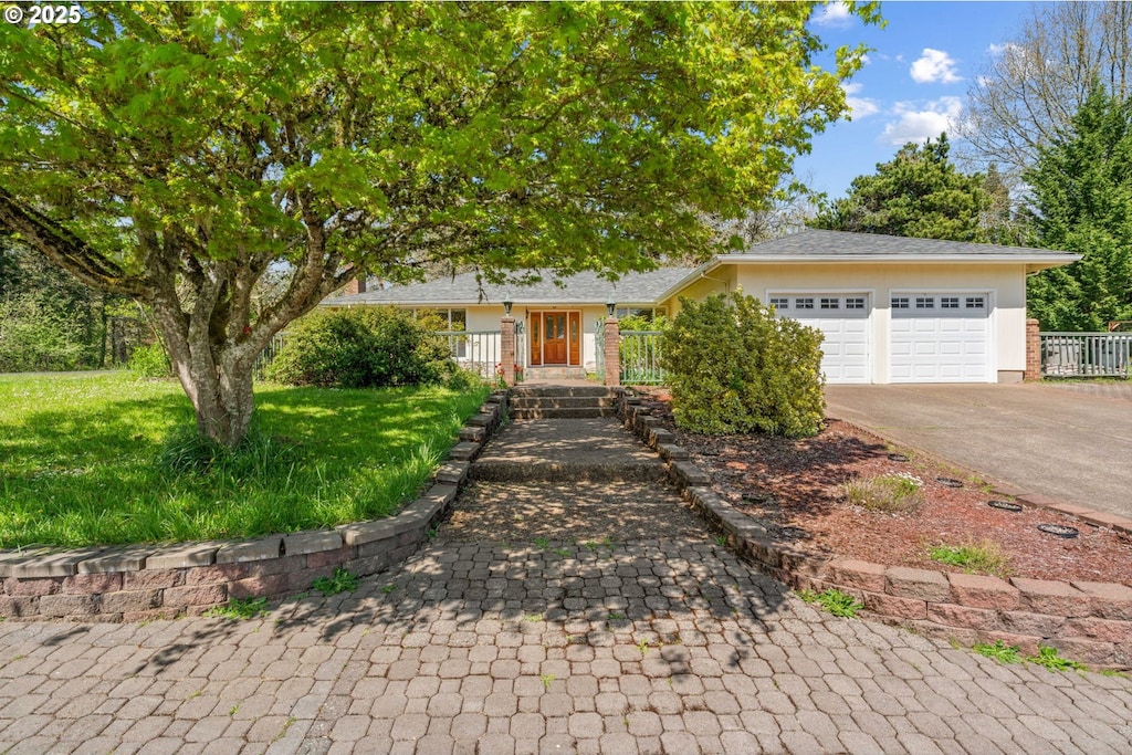 6791 SW Randall Way, Corvallis, OR 97333 - view of front of house with a garage, driveway, and a front lawn
