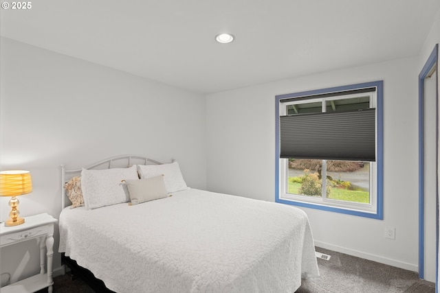 carpeted bedroom featuring recessed lighting and baseboards