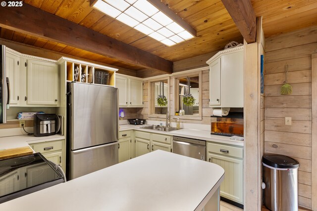 596 Sable Dr, Roseburg, OR 97470 - kitchen featuring stainless steel appliances, wooden ceiling, a sink, light countertops, and beamed ceiling