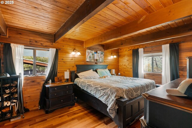 596 Sable Dr, Roseburg, OR 97470 - bedroom featuring multiple windows, light wood-style floors, beamed ceiling, wooden ceiling, and wood walls