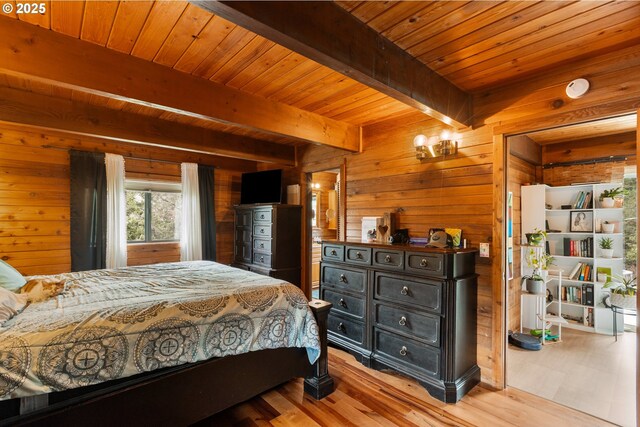 596 Sable Dr, Roseburg, OR 97470 - bedroom featuring wood walls, beam ceiling, light wood-style floors, and wooden ceiling