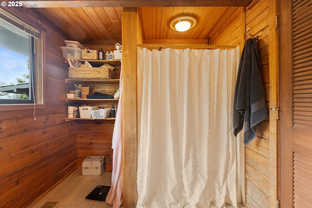 596 Sable Dr, Roseburg, OR 97470 - bathroom with wood walls, wooden ceiling, wood finished floors, and a shower with curtain