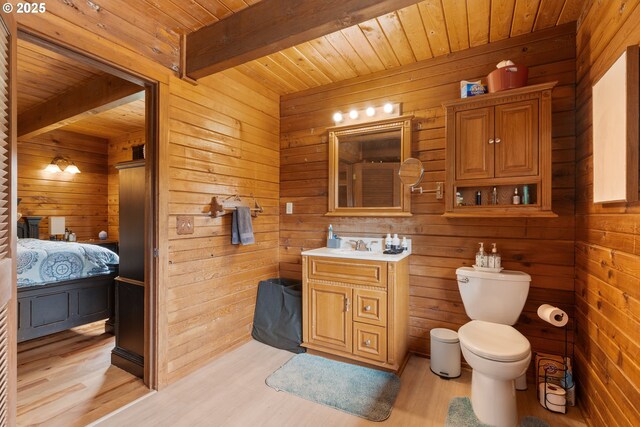 596 Sable Dr, Roseburg, OR 97470 - bathroom with wooden ceiling, wooden walls, beam ceiling, wood finished floors, and toilet