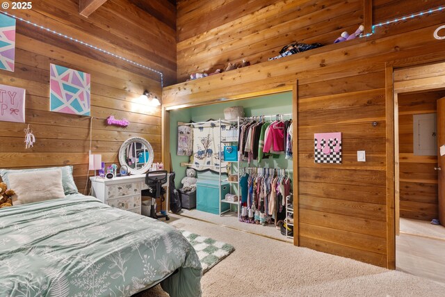 596 Sable Dr, Roseburg, OR 97470 - bedroom with wooden walls, a closet, and carpet