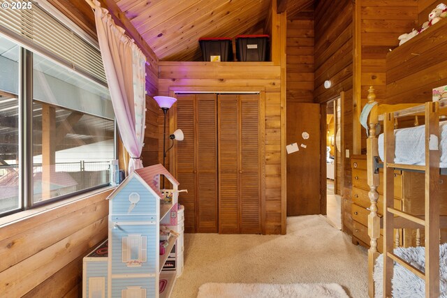 596 Sable Dr, Roseburg, OR 97470 - carpeted bedroom with wooden walls and a closet