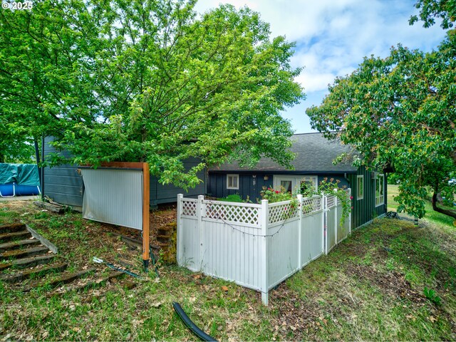 596 Sable Dr, Roseburg, OR 97470 - rear view of house with fence and roof with shingles