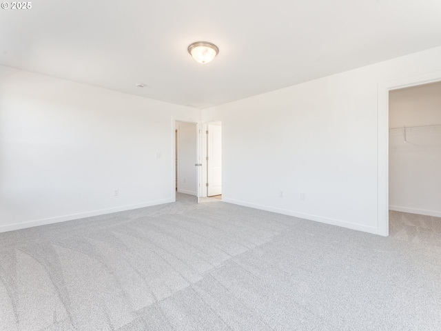 532 SW 23rd St, Battle Ground, WA 98604 - unfurnished bedroom with carpet floors, a spacious closet, baseboards, and a closet