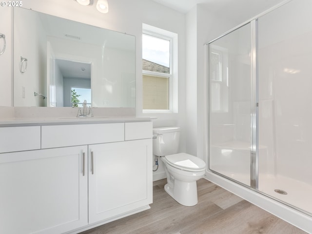 532 SW 23rd St, Battle Ground, WA 98604 - bathroom featuring a stall shower, vanity, wood finished floors, and toilet