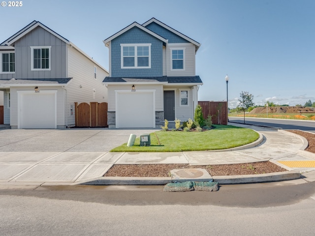 532 SW 23rd St, Battle Ground, WA 98604 - view of front of home with a garage, driveway, and stone siding