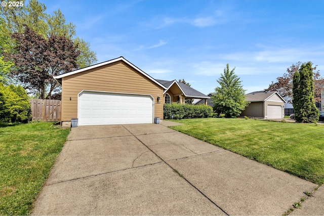 single story home featuring a front lawn, driveway, a garage, and fence