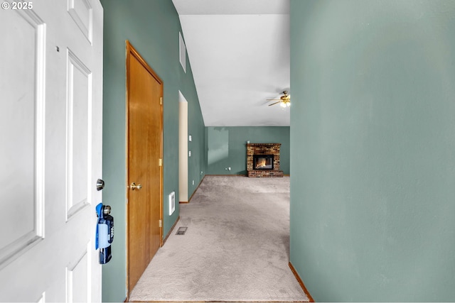 hallway with light colored carpet and visible vents