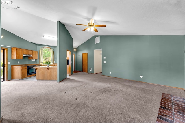 unfurnished living room featuring lofted ceiling, light colored carpet, ceiling fan, visible vents, and baseboards