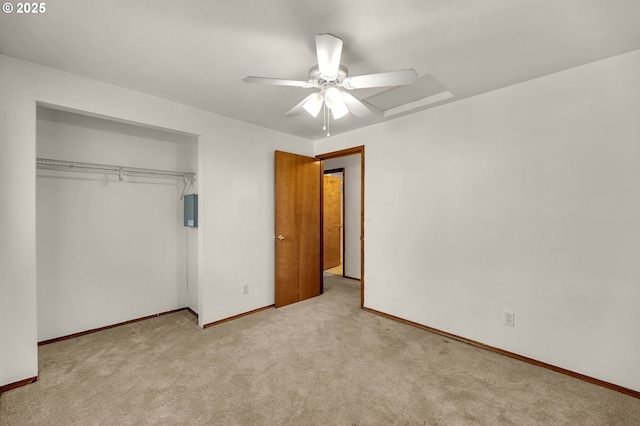 unfurnished bedroom with a closet, electric panel, ceiling fan, baseboards, and carpet floors