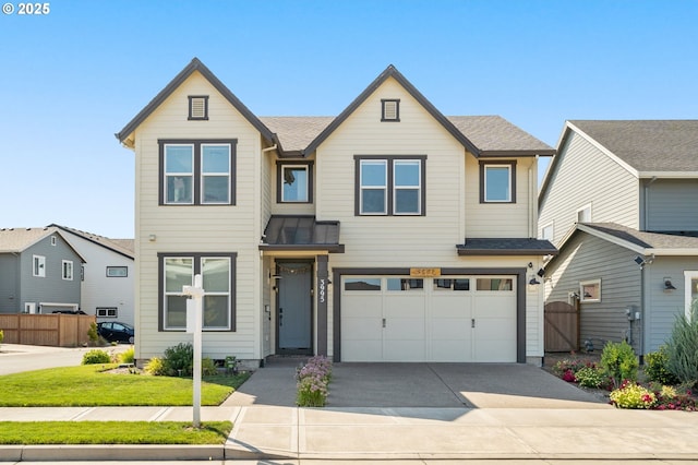 view of front of home with a front yard and a garage