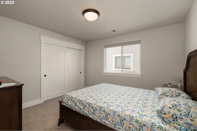 carpeted bedroom with a closet