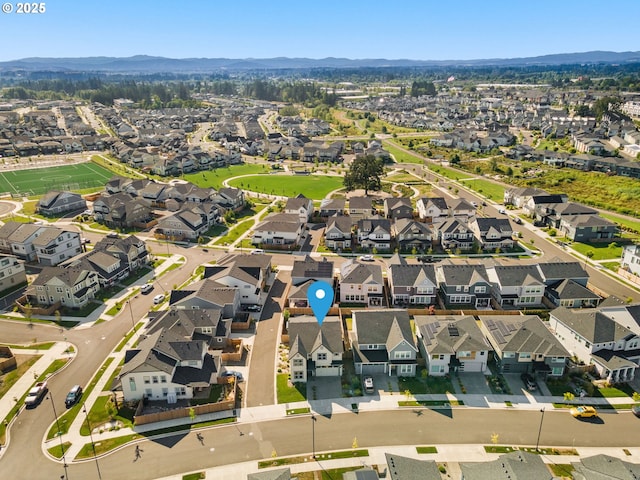 birds eye view of property with a mountain view