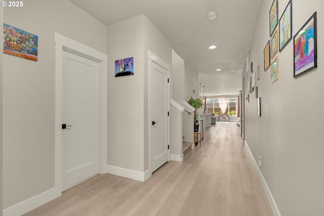 corridor featuring light hardwood / wood-style floors