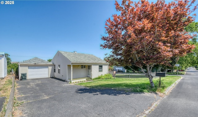 3103 SW Kirk Ave, Pendleton, OR 97801 - view of front of home featuring asphalt driveway, a detached garage, and a shingled roof