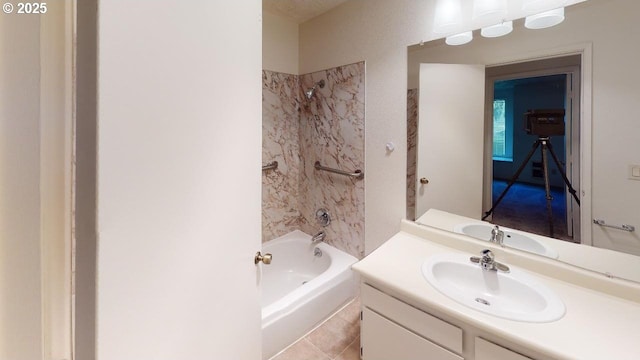 bathroom with tiled shower / bath, vanity, and tile patterned floors