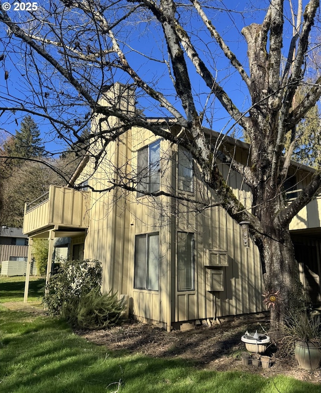 view of property exterior with a yard