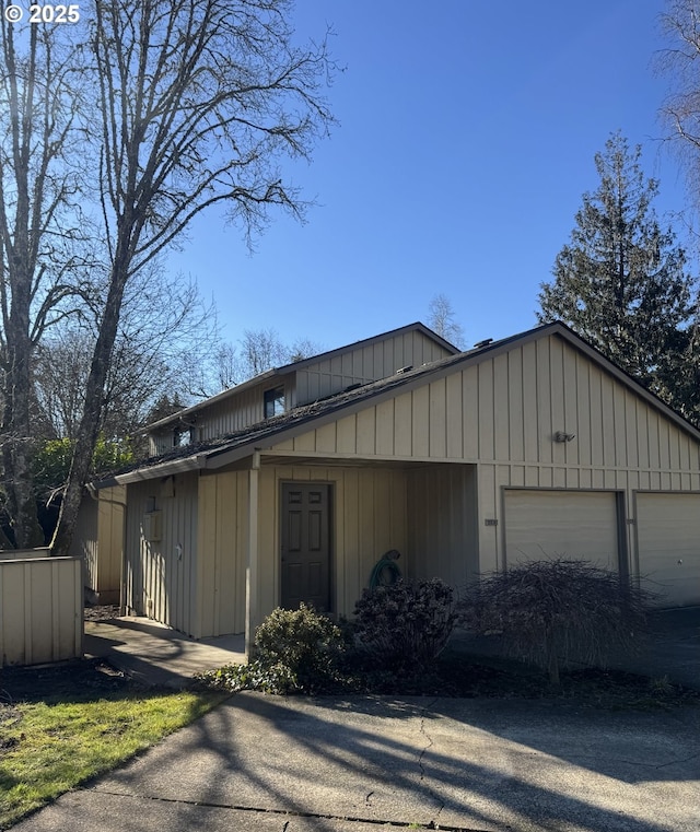 view of side of home featuring a garage