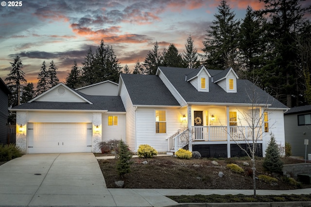 cape cod home with a porch and a garage