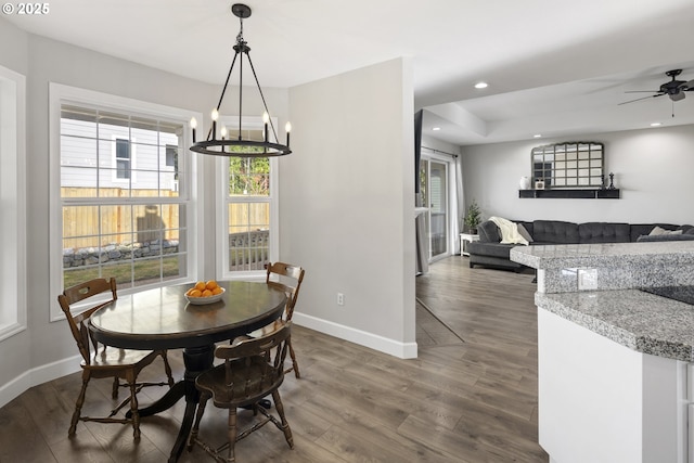 dining room featuring ceiling fan and dark hardwood / wood-style floors