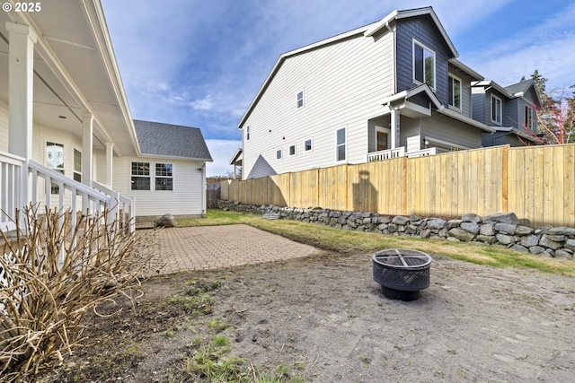 view of yard featuring a patio area and an outdoor fire pit