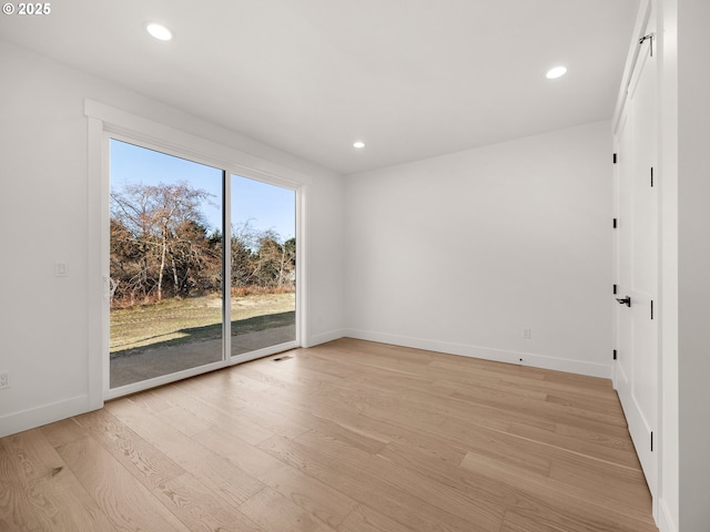 unfurnished room featuring light hardwood / wood-style flooring