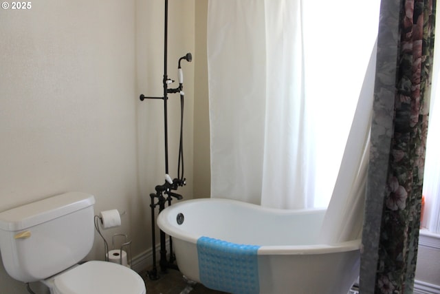 1407 9th St, Baker City, OR 97814 - bathroom featuring toilet and a freestanding bath