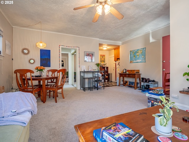 2312 SE Madison St, Portland, OR 97214 - living area featuring a ceiling fan, a textured ceiling, ornamental molding, and carpet