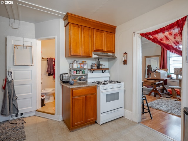 kitchen with white range with gas cooktop