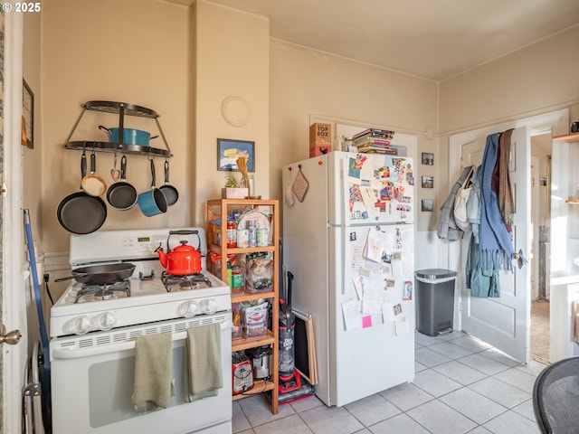 2312 SE Madison St, Portland, OR 97214 - kitchen featuring white appliances and light tile patterned floors
