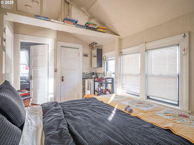 bedroom featuring lofted ceiling