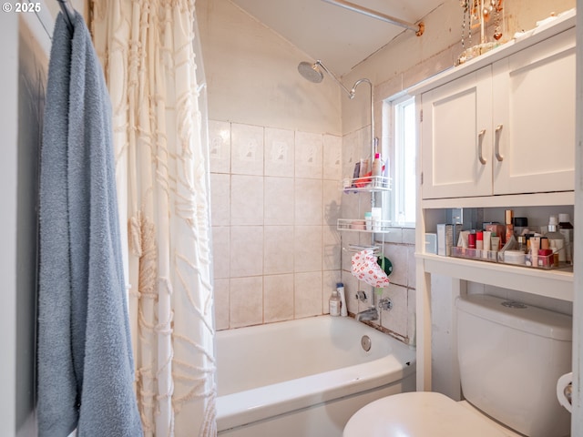 bathroom featuring shower / bathtub combination with curtain and toilet