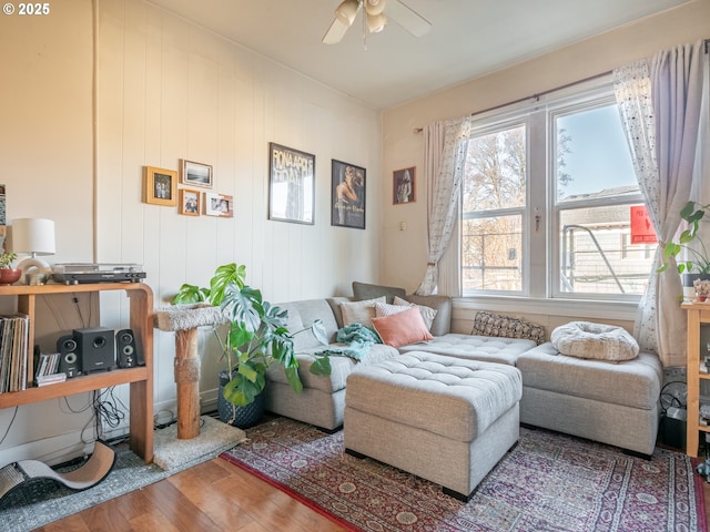 living room with hardwood / wood-style flooring and ceiling fan