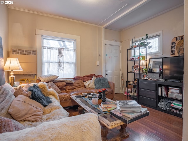 living room with hardwood / wood-style flooring and ornamental molding